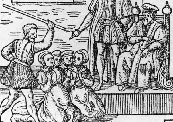 A group of supposed witches are beaten in front of King James VI about 1610. Picture: Hulton Archive