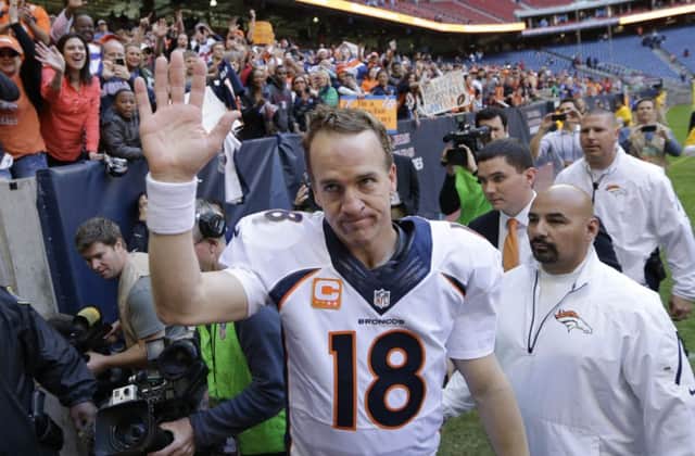 Bronco Peyton Manning greets fans after his 51st touchdown in Houston. Picture: AP