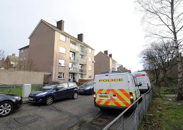 Police vans outside Edinburgh's Glenure Loan, where a man was killed on Christmas Day. Picture: Julie Bull