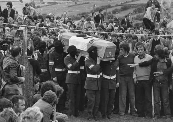 Masked IRA members carry the coffin of hunger striker Martin Hurson in 1981. Picture: Getty Images