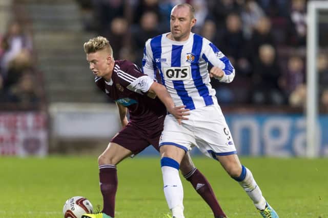 Hearts' Adam King holds off Kilmarnock striker Kris Boyd. Picture: SNS
