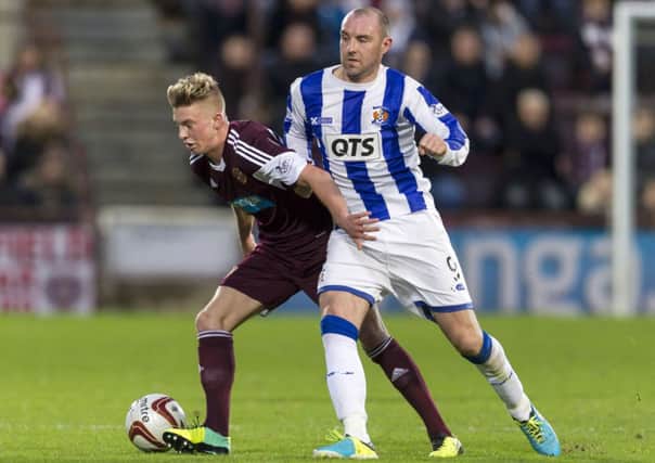 Hearts' Adam King holds off Kilmarnock striker Kris Boyd. Picture: SNS