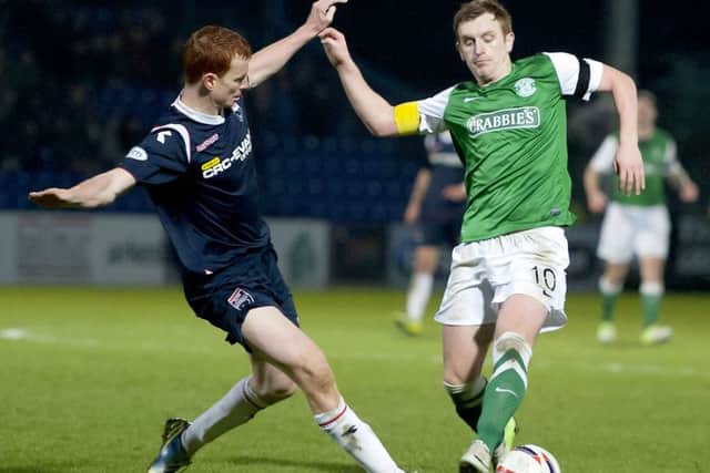 Ross County's Scott Boyd (left) tackles Liam Craig. Picture: SNS
