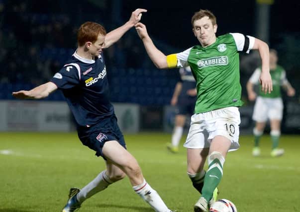Ross County's Scott Boyd (left) tackles Liam Craig. Picture: SNS