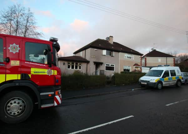Emergency services at the scene of a house fire on Hermiston Road that claimed the life of Mary McConnell. Picture: Hemedia