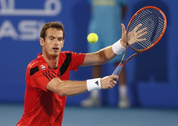 Andy Murray stretches for a backhand in his first outing since back surgery. Picture: Reuters