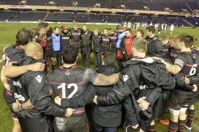 The Edinburgh squad convene at full time after defeat to Glasgow. Picture: SNS