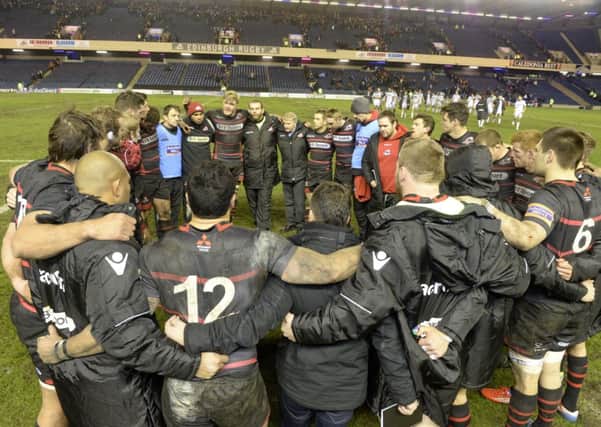 The Edinburgh squad convene at full time after defeat to Glasgow. Picture: SNS