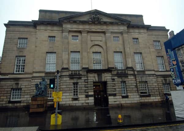 The High Court in Edinburgh heard that Fisher admitted the attack in a 999 call. Picture: TSPL