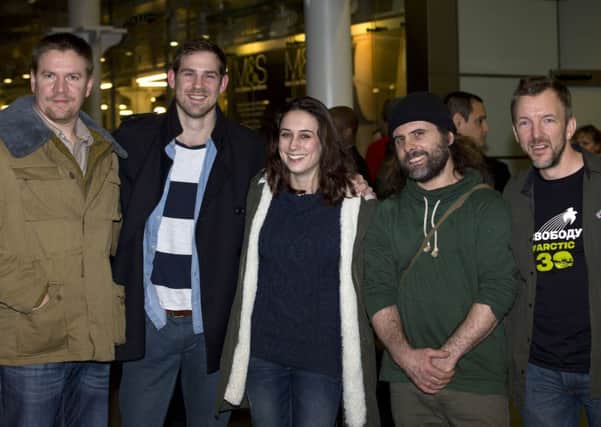 Greenpeace activists Anthony Perrett, journalist Kieron Bryan, Alexandra Harris, Iain Rogers and Phil Ball arrive in London. Picture: Getty