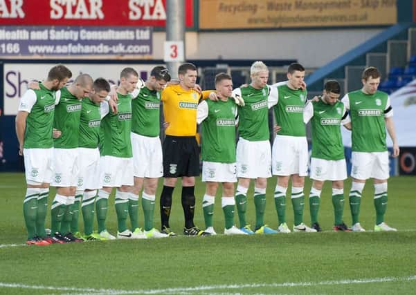Hibernian observe a minute's silence ahead of the Ross County game. Picture: SNS