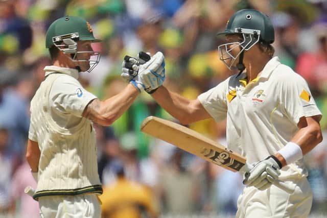 Michael Clarke (L) and Shane Watson embrace as Australia win the the fourth Test in Melbourne. Picture: Getty