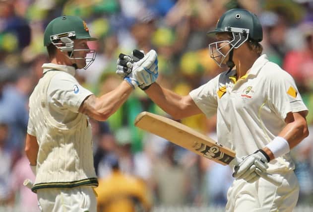 Michael Clarke (L) and Shane Watson embrace as Australia win the the fourth Test in Melbourne. Picture: Getty