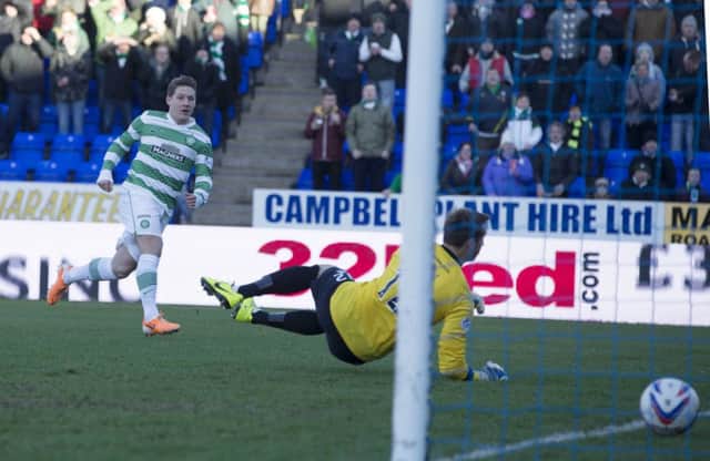 Kris Commons scores early in the game for Celtic. Picture: PA