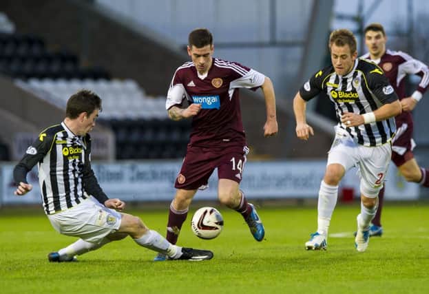 Jamie Walker's is challenged by St Mirren's Sean Kelly (left) and Danny Granger. Picture: SNS