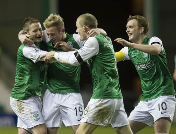 Paul Cairney (left) is congratulated after scoring Hibernian's second goal of the match. Picture: SNS