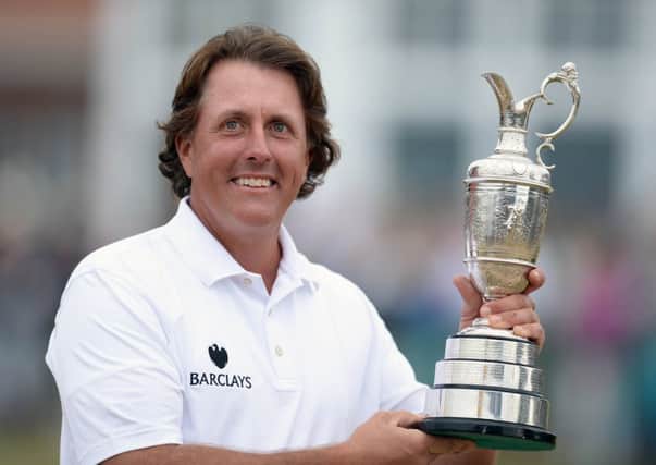 Phil Mickelson holds the Open trophy after his Muirfield win. Picture: Ian Rutherford