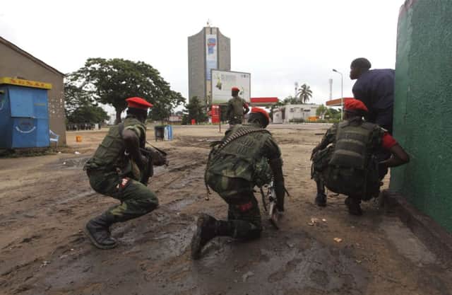 Soldiers in Kinshasa secure the streets close to the TV station. Picture: Reuters
