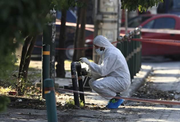 A forensics officer at the scene; the ambassador praised the swift response of the police. Picture: AP