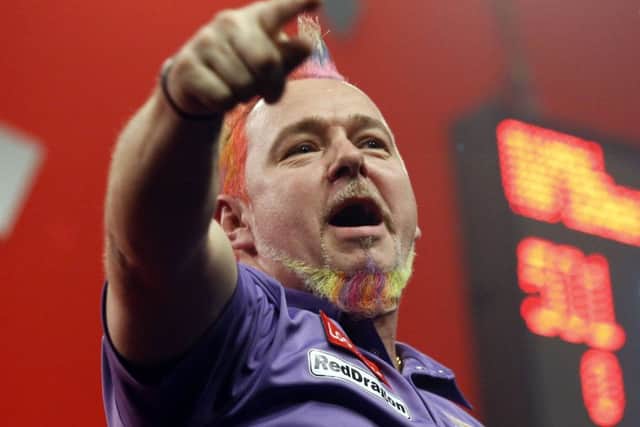 Peter Wright celebrates victory over Simon Whitlock to reach the PDA World Championship final. Picture: PA