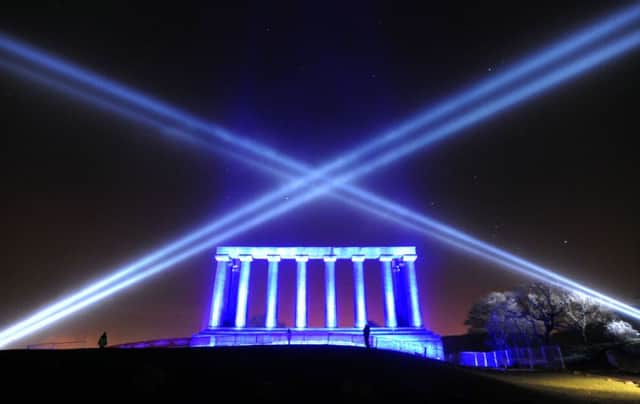 Calton Hill is lit up to mark the start of Edinburgh's Hogmanay celebrations. Picture: Jane Barlow