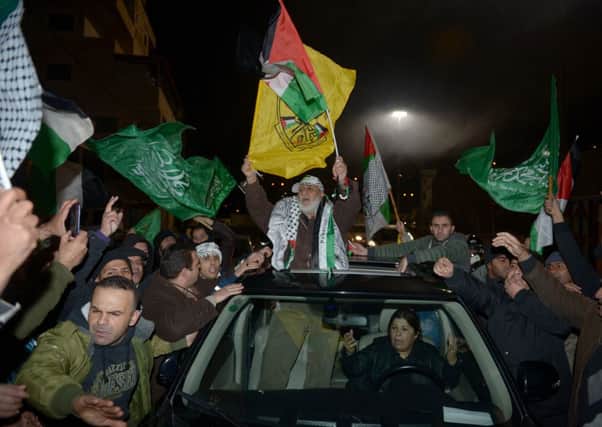 Deajneh Suhuffat with his relatives in Jerusalem as Israel released 26 Palestinian prisoners. Picture: Getty