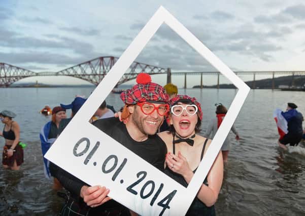 Two brave 'dookers' pictured in the icy Forth on New Year's Day. Picture: Neil Hanna