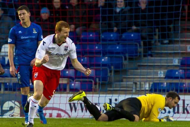 Scott Boyd wheels away after scoring Ross County's opening goal. Picture: SNS