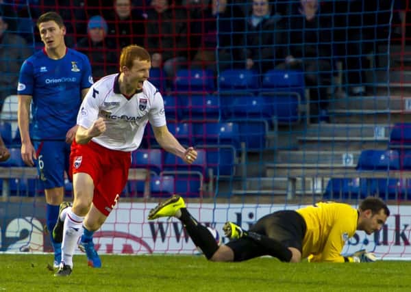 Scott Boyd wheels away after scoring Ross County's opening goal. Picture: SNS