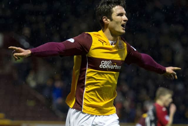 John Sutton celebrates opening the scoring for Motherwell. Picture: SNS