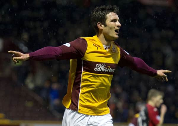 John Sutton celebrates opening the scoring for Motherwell. Picture: SNS
