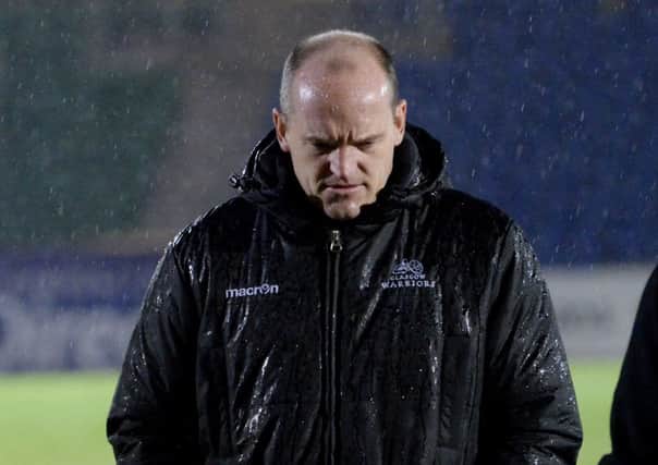 Glasgow Warriors Head Coach Gregor Townsend trudges off the Scotstoun field after the game is called off. Picture: SNS