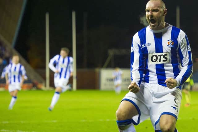 Kris Boyd roars with delight after firing the winner. Picture: SNS
