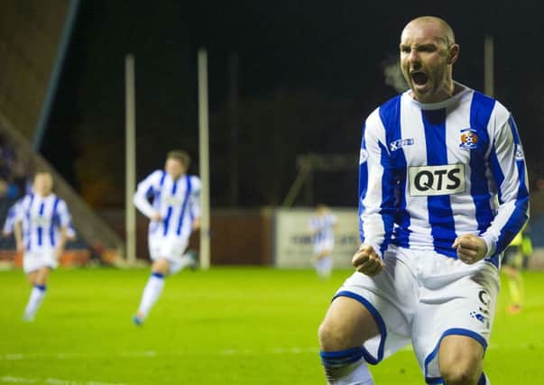 Kris Boyd roars with delight after firing the winner. Picture: SNS