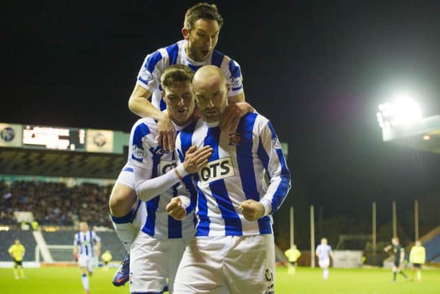 Kris Boyd is congratulated by Barry Nicholson, top, and Robbie Muirhead. Picture: SNS