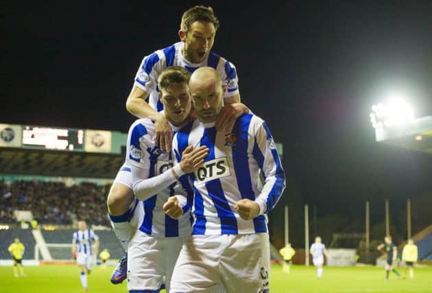 Kris Boyd is congratulated by Barry Nicholson, top, and Robbie Muirhead. Picture: SNS