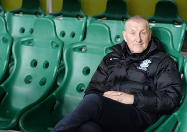 Terry Butcher looks relaxed as he poses for photographers before the game. Picture: SNS