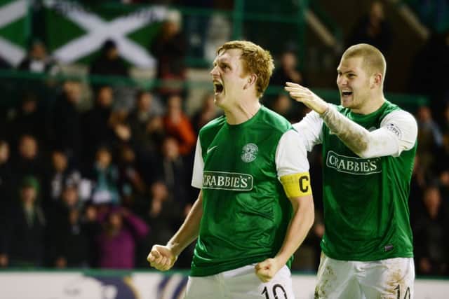 James Collins, right, congratulates Hibs captain Liam Craig. Picture: SNS