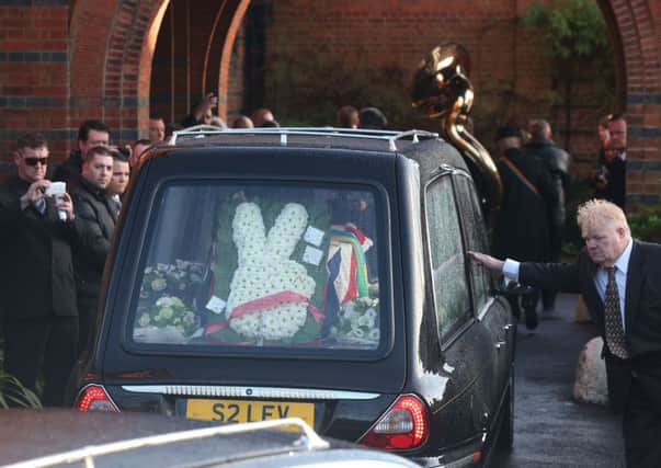 A floral wreath flanking Ronnie Biggss coffin reflects the train robbers attitude to authority. Picture: Getty