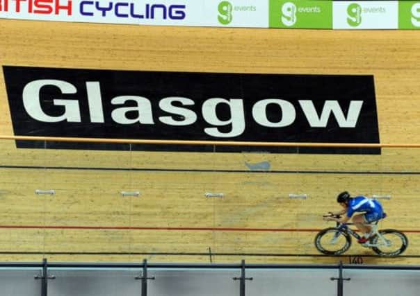 The Sir Chris Hoy Velodrome in Glasgows East End, centre of track cycling for the games. Far left: Barclays Antony Jenkins. Photograph: Ian Rutherford