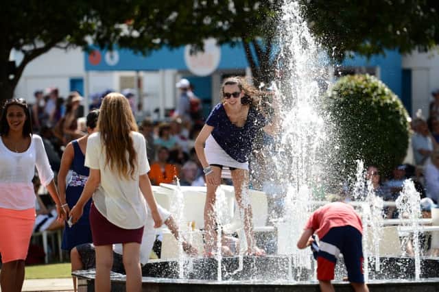 Sun worshippers in Melbourne, Victoria, cool off in a fountain  last year was the hottest on record. Picture: Getty