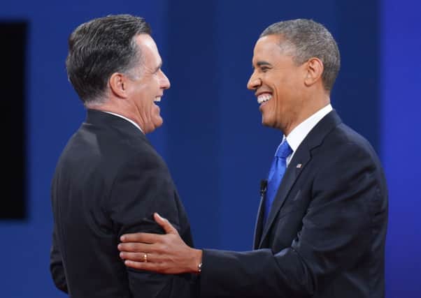Barack Obama and Mitt Romney both raised 1bn to campaign. Picture: AFP/Getty