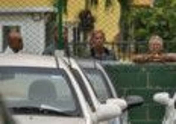 Cubans inspect cars for sale. Picture: Reuters