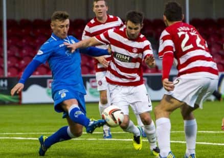 Chris Mitchell (left) challenges Hamilton's James Keatings. Picture: SNS