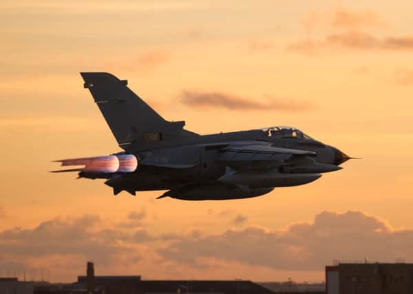 A Tornado jet during a trial of components produced by BAE Systems using a 3D printer such as the one. Picture: BAE/PA