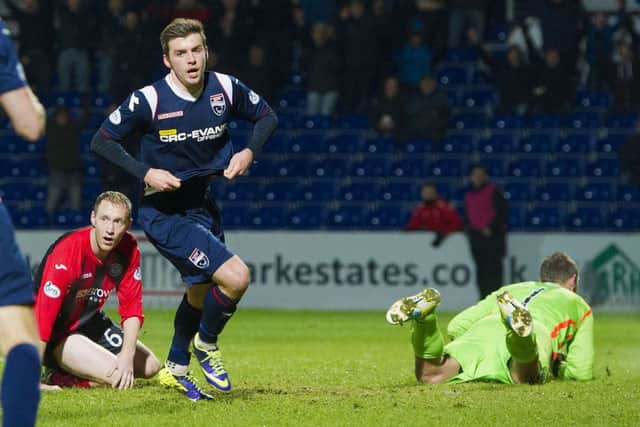 Ross Countys Graham Carey wheels away to celebrate after scoring the only goal of the game with just two minutes remaining. Picture: SNS