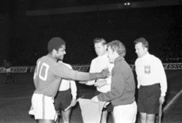 Captains Eusebio and Billy Bremner exchange pennants before the Hampden clash. Picture: Bill Stout