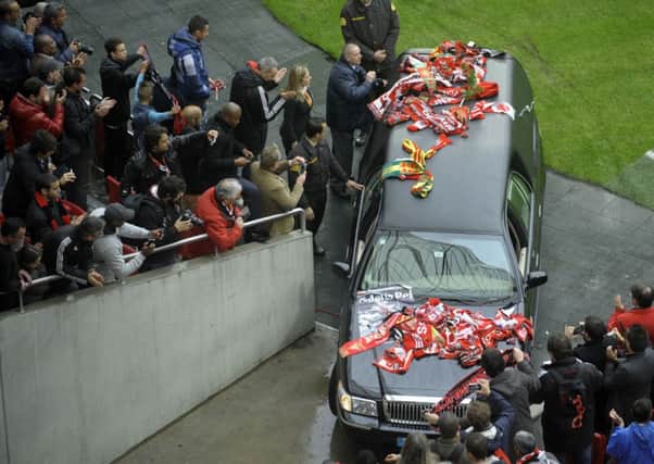 A car with the coffin of Benfica football legend Eusebio leaves Benfica's Luz Stadium. Picture: Getty