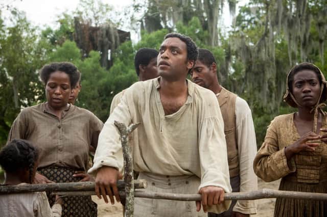 Chiwetel Ejiofor, centre, in a scene from 12 Years A Slave. Picture: AP