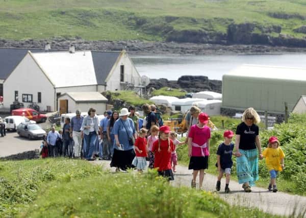 Eigg residents on their way to celebrate the anniversary of the communal purchase of the island. Picture: Jane Barlow